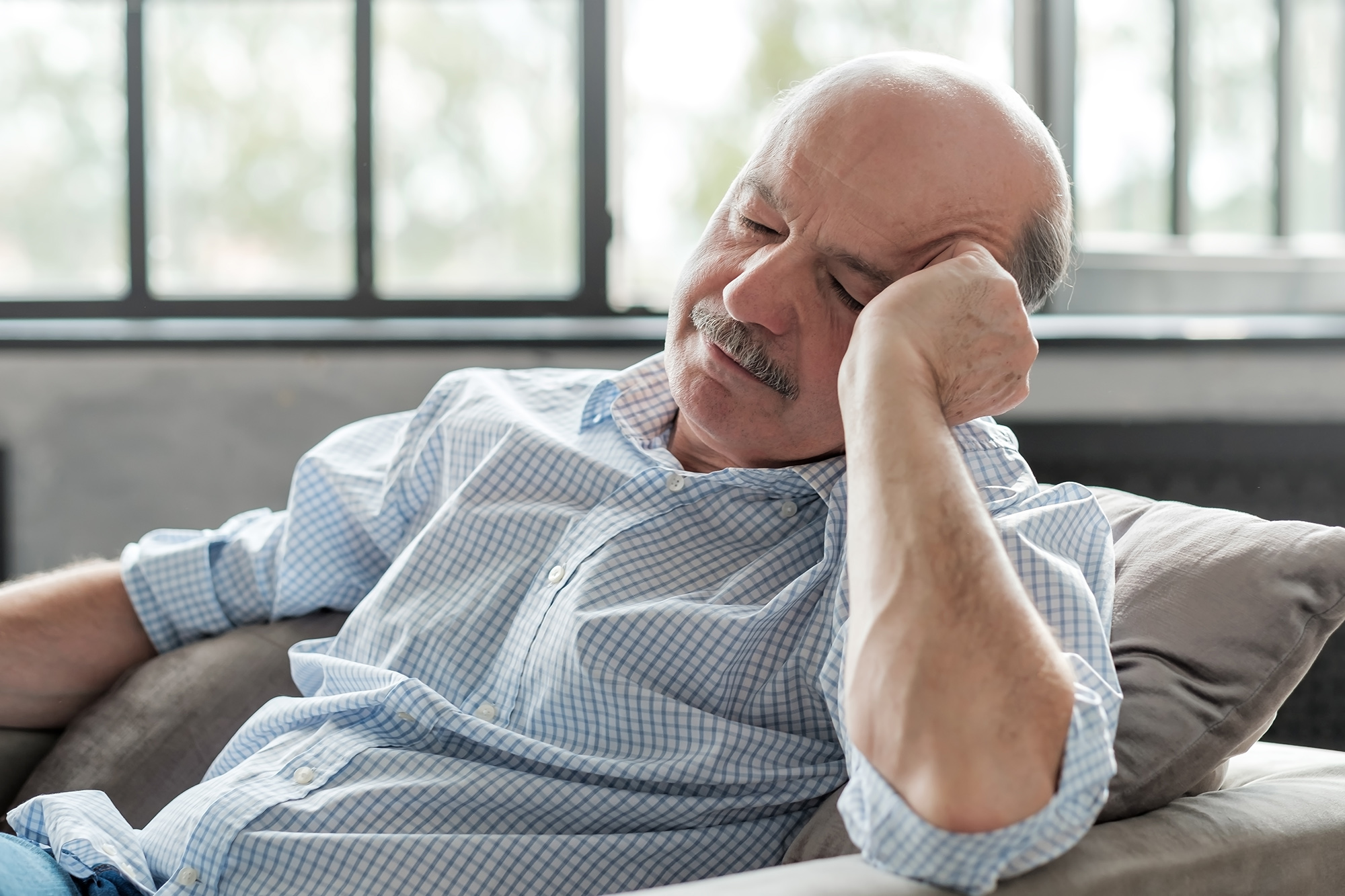 man sleeping in a chair