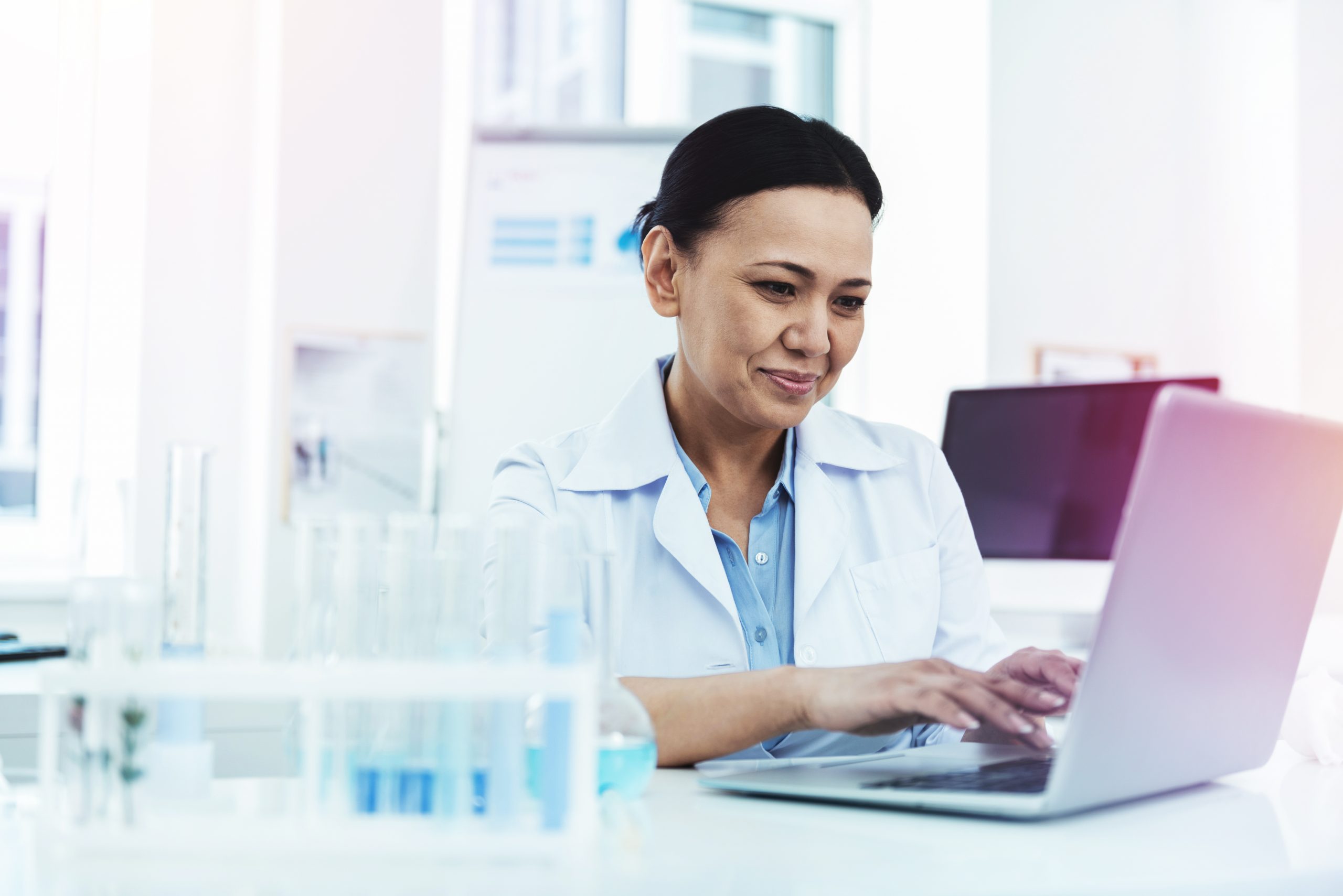 researcher-at-computer-smiling