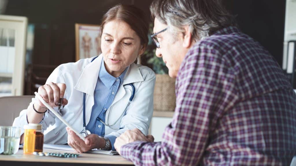 female doctor talking with male patient questions