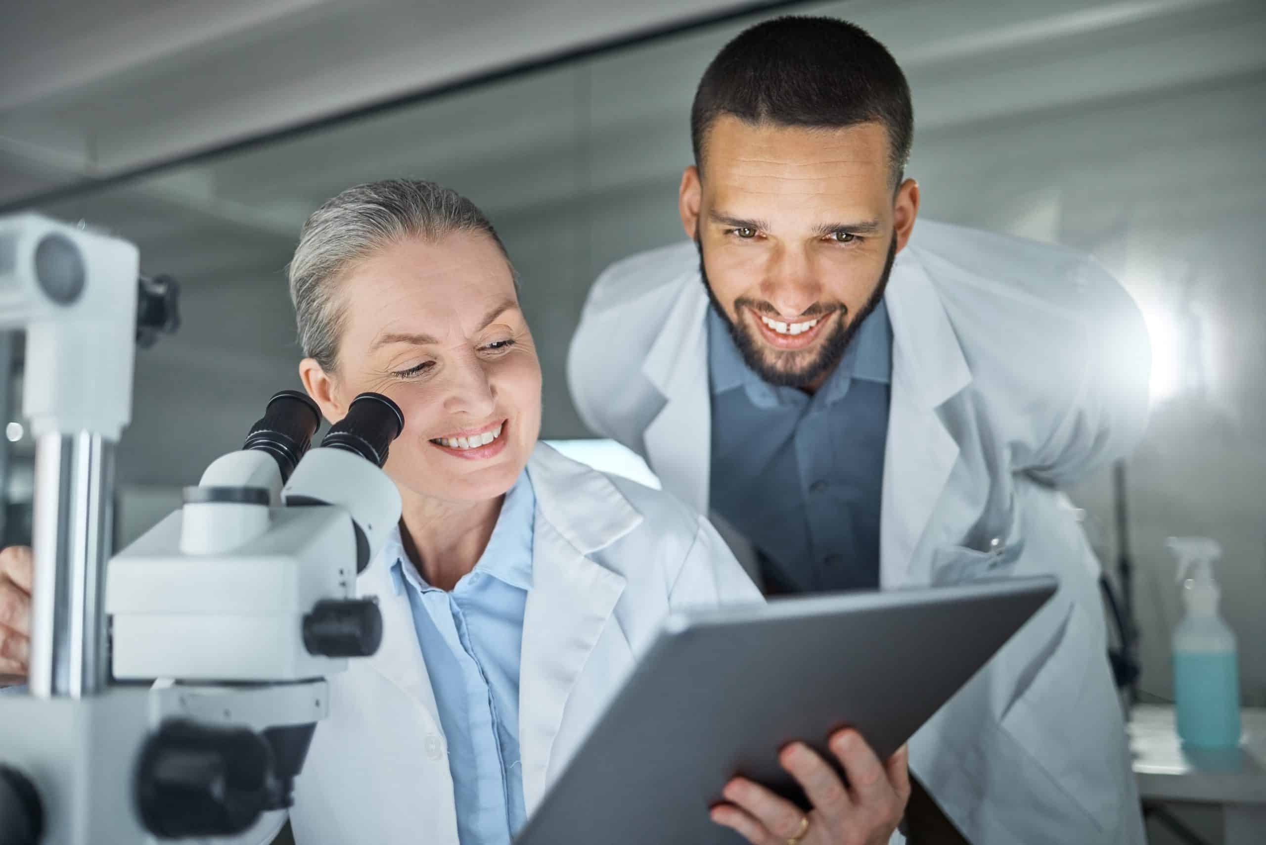 female researcher with male researcher