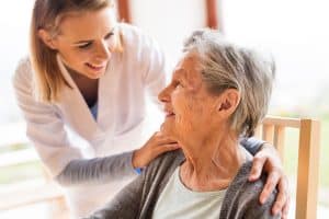 Health visitor and a senior woman during home visit